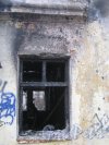 Пр. Ветеранов, дом 141, корпус 2. Окно сгоревшего дома. Фото февраль 2014 г.