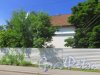 город Сестрорецк, улица Коммунаров, дом 57. Фасад со стороны улицы Коммунаров. Фото 27 июля 2015 года.